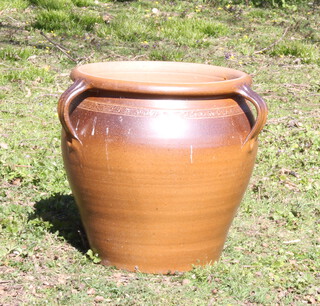A circular terracotta 3 handled urn 49cm h x 43cm diam. 
