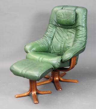 A stressless style armchair upholstered in green leather (section of leather missing to the piping and tear to side of seat) together with a footstool (recliner not working)