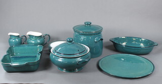 A quantity of green glazed Denby Greenwich table china comprising 2 tureens and covers, 2 section dish, 5 saucers, 2 jugs, an oval casserole and a platter 