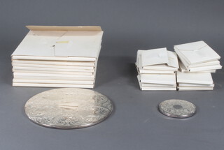 A quantity of silver plated place mats and coasters 