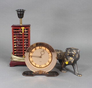 An Art Deco Smiths electric timepiece, a pair of Abacus table lamps and minor decorative items 