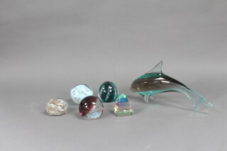 Five glass paperweights together with a ditto dolphin 