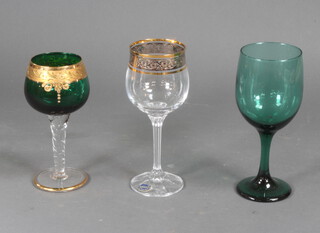 Three sets of wine glasses to include 6 green wine glasses, 6 gilt decorated coloured wine glasses and 6 clear gilt wine glasses