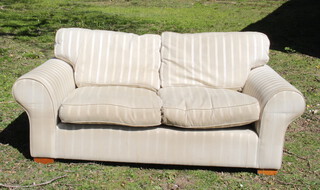 A sofa upholstered in white striped material 58cm h x 97cm w x 39cm d(some light staining in places) 
