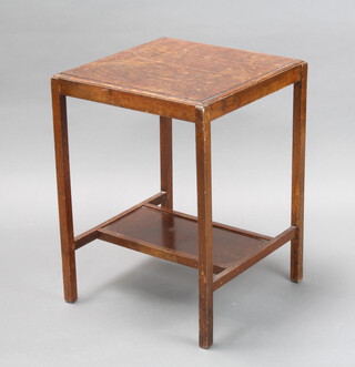 A 1930's square oak occasional table with undertier raised on square supports 67cm h x 49cm w x 49cm d 