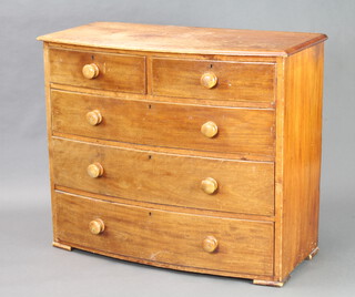 A Victorian pine bow front chest of 2 short and 3 long drawers with tore handles 91cm h x 108cm w x 52cm d (some water damage to the top) 