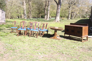 A 1930's carved oak dining suite comprising a refectory dining table of plank construction raised on 4 spiral turned column supports united by an H framed stretcher 74cm h x 183cm l x 99cm w (some light scratches and water marks in places), together with a set of 10 slat back dining chairs - 2 carvers, 8 standard and matching sideboard with raised back fitted 3 drawers above panelled doors on square supports with box framed stretcher 112cm h x 170cm w x 55cm d 
