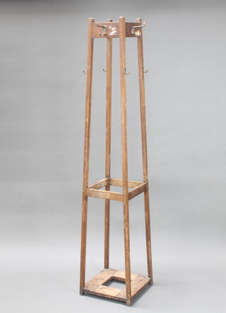 A 1930's tapered square oak hat, coat and umbrella stand  71cm x 36cm x 36cm (drip tray to base missing)