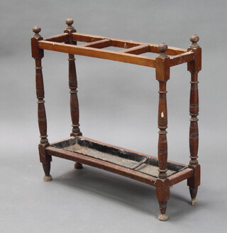An Edwardian rectangular oak umbrella/stick stand raised on turned supports, complete with drip tray 69cm h x 69cm w x 23cm d (damage to 1 of the feet) 