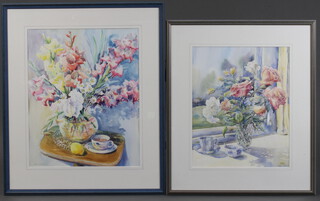 Karen Pearson, watercolour, still life study of a vase of flowers with cup of tea and a lemon on a tripod table 52cm x 42cm and one other still life study, signed, 45cm x 36cm