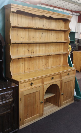 A Victorian style country house pine dog kennel dresser, the raised back with moulded cornice and 3 shelves, the base fitted 3 drawers with dog kennel recess flanked by a pair of cupboards 220cm h x 170cm w x 43cm d 