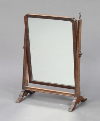 A 19th Century rectangular plate dressing table mirror contained in a mahogany swing frame 43cm h x 31cm w x 17cm d (1 finial missing) 
