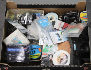 A box of sea fishing tackle including 2 boat reels, rigs, hooks, weights, etc, etc,  