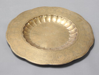 A circular Eastern embossed brass charger 77cm diam. 