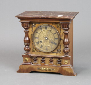 A Victorian striking mantel clock with gilt dial and Roman numerals in a carved walnut case 30cm x 32cm x 16cm 