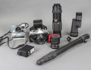 A Fujica ST605 camera together with a quantity of lenses, tripod etc