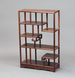 A Chinese padauk wood set of open shelves with carved decoration 66cm x 42cm x 16cm 