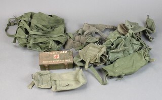 A military metal emergency first aid box together with a quantity of webbing 