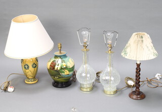 A pair of crackle glass club shaped table lamps 30cm, a spiral turned table lamp 29cm, a pottery table decorated a Dutch style landscape 33cm and 1 other lamp decorated flowers 36cm 