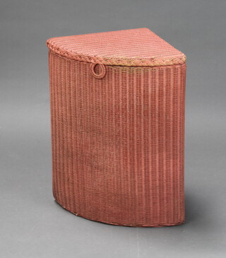 A pink painted Lloyd Loom corner linen basket, the base marked July '32, 55cm x 46cm x 33cm 