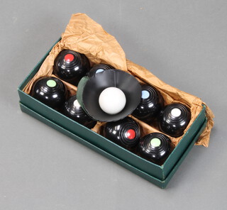 A boxed set of B & A indoor carpet bowls 