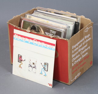 A cardboard box containing a collection of 1970's LP album records including Beatles, John Martyn etc 
