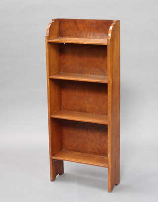 An oak 4 tier bookcase 99cm h x 41cm w x 15cm d 