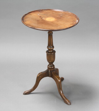 An Edwardian circular inlaid mahogany wine table raised on bulbous turned tripod and column base 65cm h x 44cm diam. (veneer to the centre is lifting, the base has been stuck and there is an old repair to the tripod base)