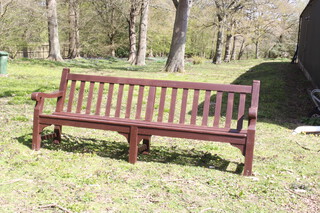 A wooden slatted bench marked Newton Driver Services Club 90cm h x 244cm w 44cm d