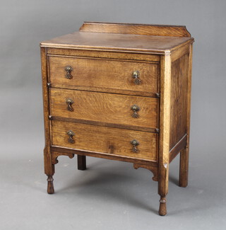 A 1930's James Shoolbred & Co oak chest with raised back, fitted 3 drawers on turned supports 100cm h x 75cm w x 47cm d 