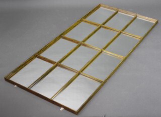 A rectangular plate mirror in the form of a window contained in a woodgrain effect frame 160cm x 73cm 