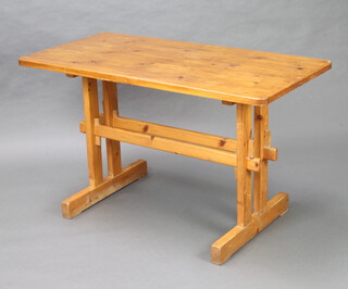 A rectangular pine refectory style dining table raised on square supports with H framed stretcher 72cm h x 122cm l x 61cm w  