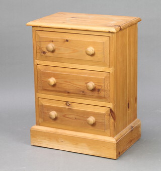 A Victorian style pine chest of 3 long drawers, raised on a platform base 60cm h x 45cm w x 29cm d 