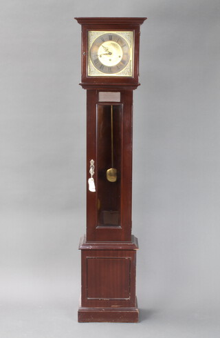 Metamec, a striking longcase clock the 24cm square gilt dial with silvered chapter ring and Roman numerals, contained in a mahogany case with sliding hood, complete with key and pendulum  152cm h x 34cm w x 21cm d 