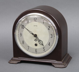 Smiths, a 1930's war office issue mantel clock, the 15cm silvered dial with Arabic numerals contained in a brown Bakelite arched case 20cm h x 21cm w x 12cm d  