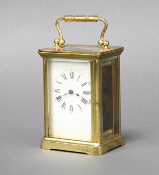A 19th Century French 8 day carriage timepiece with enamelled dial and Roman numerals, contained in a gilt metal case 10cm h x 6cm w x 7cm d 