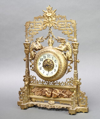 VAP Brevete, a Victorian mantel timepiece with 9cm enamelled dial and Roman numerals contained in a gilt metal case in the form of an easel, supported by dragons and having masks to the base, the back plate marked VAP Brevete S.S.D.G, the base marked RD No. 44632 41cm h x 30cm w x 10cm d 