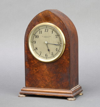 An Edwardian 8 day timepiece, the 9cm silvered dial marked A L Canham & Son London North West 1, contained in a figured walnut lancet case, raised on brass bun feet 22cm h x 14cm w x 8cm d 