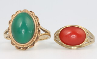 A 9ct yellow gold coral ring size K, 2.3 grams and a yellow gold malachite ring size R, 5.3 grams 