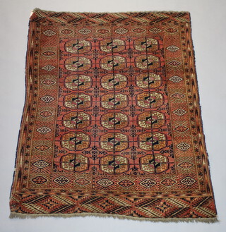 A Tekke Turkman rug with 21 octagons to the centre 154cm x 113cm 