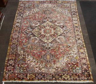 A brown and red ground Persian carpet with diamond shaped medallion to the centre within a multi row border 383cm x 274cm 
