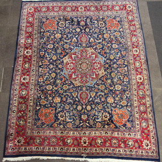 A red and blue ground Northwest Persian carpet with central medallion within a multirow border, signed, 332cm x 259cm 