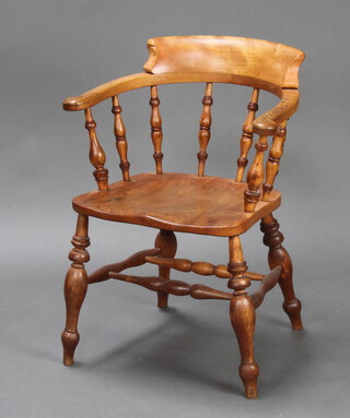 A 19th Century elm smokers bow spindle back chair, raised on turned supports with double H framed stretcher 79cm h x 60cm w x 44cm d (inside seat measurement 37cm w x 36cm d)