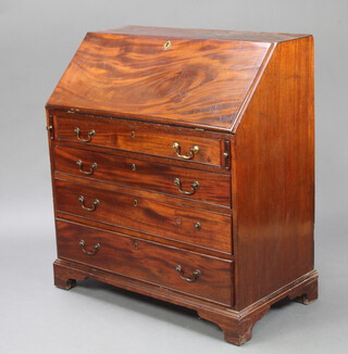A Georgian mahogany bureau, the fall front revealing a fitted interior above 4 long graduated drawers, raised on bracket feet 108cm h x 97cm w x 52cm d 