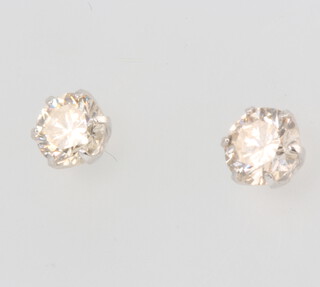 A pair of platinum single stone diamond ear studs, approx. 0.6ct, 0.5 grams