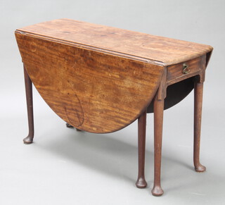 A Georgian oval drop flap gateleg dining table, fitted a frieze drawer, raised on pad feet 71cm h x 113cm w x 41cm d (closed) 134cm open 