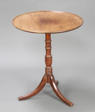 A 19th Century circular mahogany tray top wine table raised on turned column and tripod base 73cm h x 61cm w 