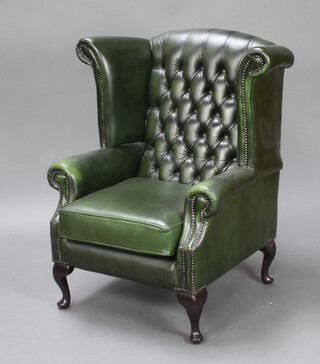A Victorian style armchair upholstered in green buttoned leather on cabriole supports 102cm h x 88cm w x 66cm d (inside seat measurement 50cm w x 53cm d) 