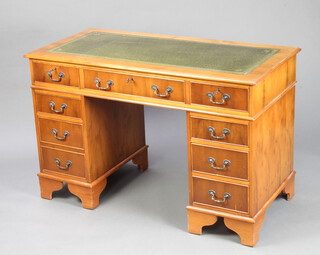 A Victorian style yew kneehole pedestal desk with green leather writing surface, fitted 1 long and 8 short drawers, raised on bracket feet 79cm h x 122cm w x 50cm d  