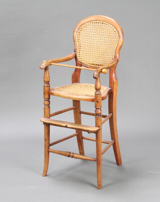 A child's Victorian bleached mahogany open arm training chair with woven cane seat and back 99cm h x 33cm w x 34cm d (seat measurements 28cm x 28cm) 
